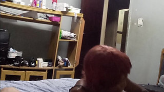 Black whore in black dress sucks tiny white cock at the hostel