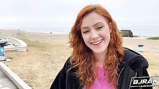 Sexy redhead beauty Cherry Candle is sucking a big cock on the knees