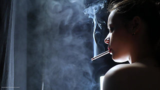 Topless Brunette Smoking in Dramatic Smoke