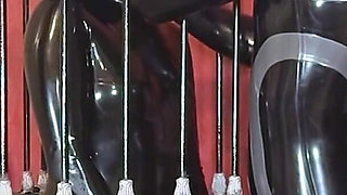 Imprisoned Rubber Slut Has to Give a Blowjob
