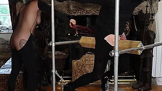 Whipped on Wooden Bondage