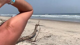 Busty MILF In Green Bikini Handjobs Her Partner On A Public Beach