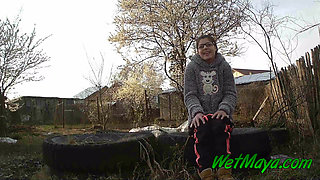 Peeing on some old tires in the yard