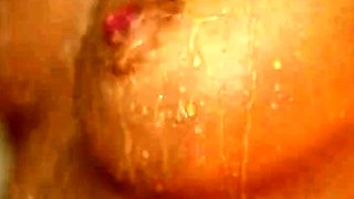 Girl playing with wax in the shower