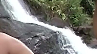 Curly Redhead MILF Rides Her Man at Waterfall