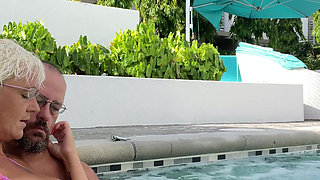 Getting frisky in the hot tub. Boob play.