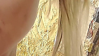 Blonde in Pantyhose Plays with a Glass Toy on the Office Chair